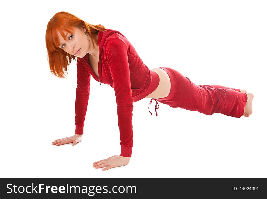 Beautiful girl does exercises on a white background. Beautiful girl does exercises on a white background