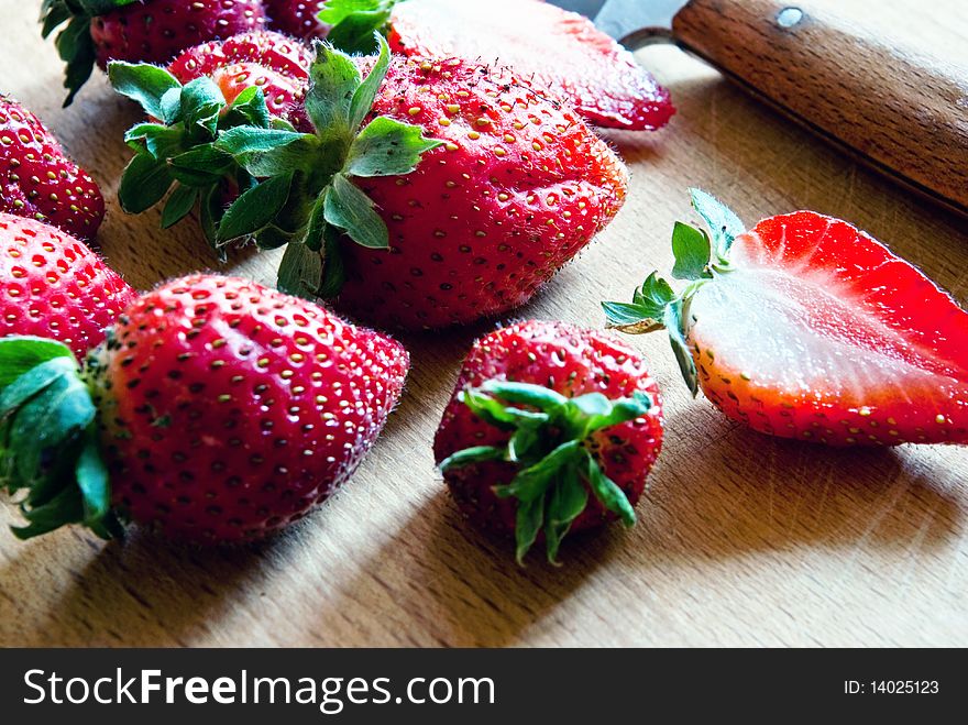 Fresh and juicy strawberries on the sunny kitchen. Fresh and juicy strawberries on the sunny kitchen