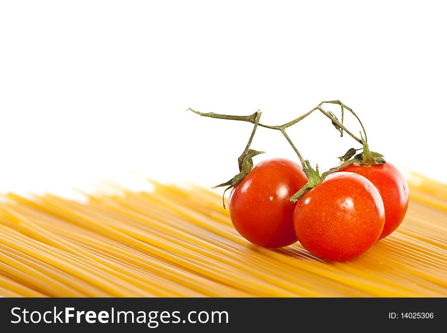 Tomatoes and pasta isolated on white