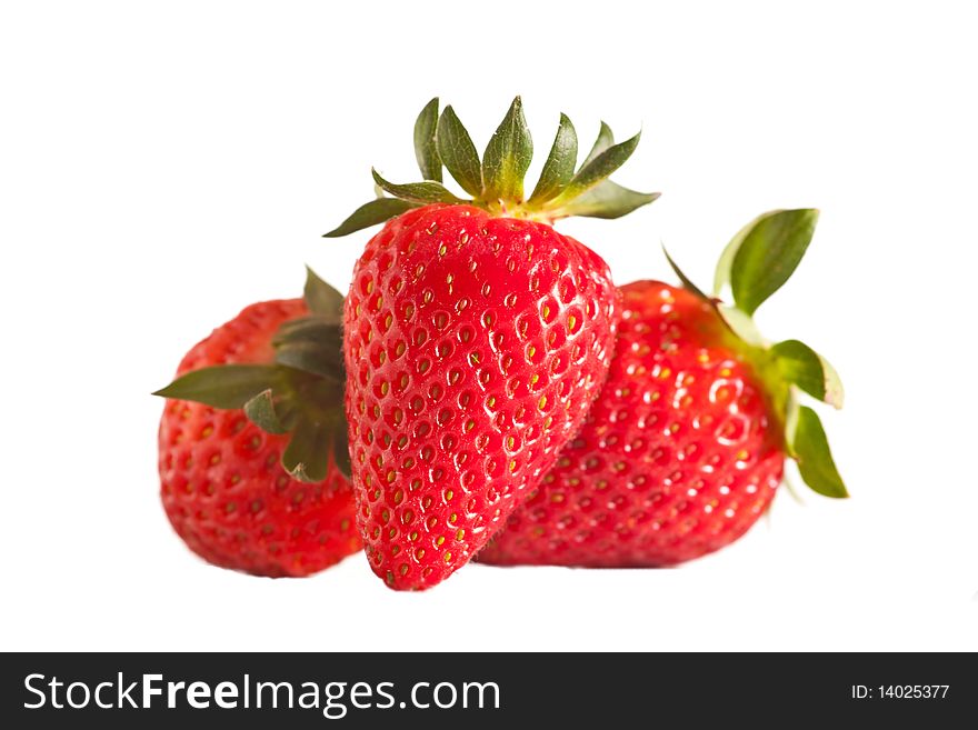 Three fresh strawberries in studio on white isolated background