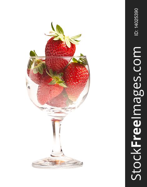 Fresh strawberries in a glass on white background