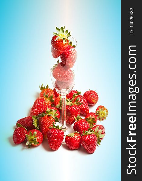 Strawberries In A Glass On Blue Background