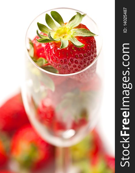Fresh strawberries in glass on white background. Fresh strawberries in glass on white background