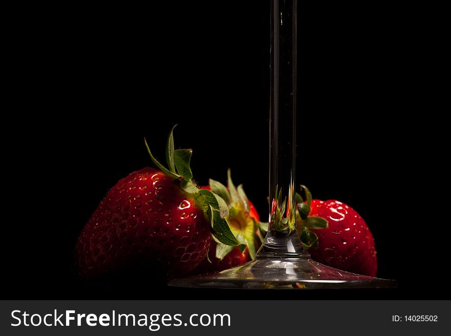 Fresh Strawberries in a glass on black background