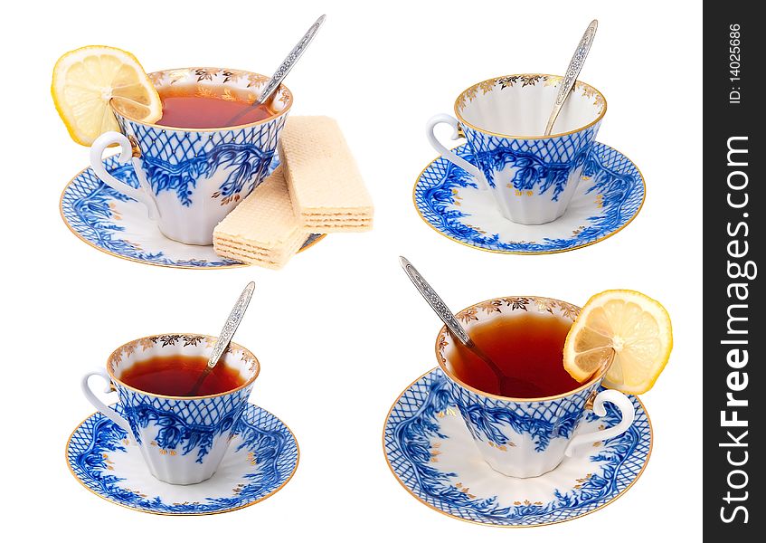 Four cups with tea on a white background. Four cups with tea on a white background