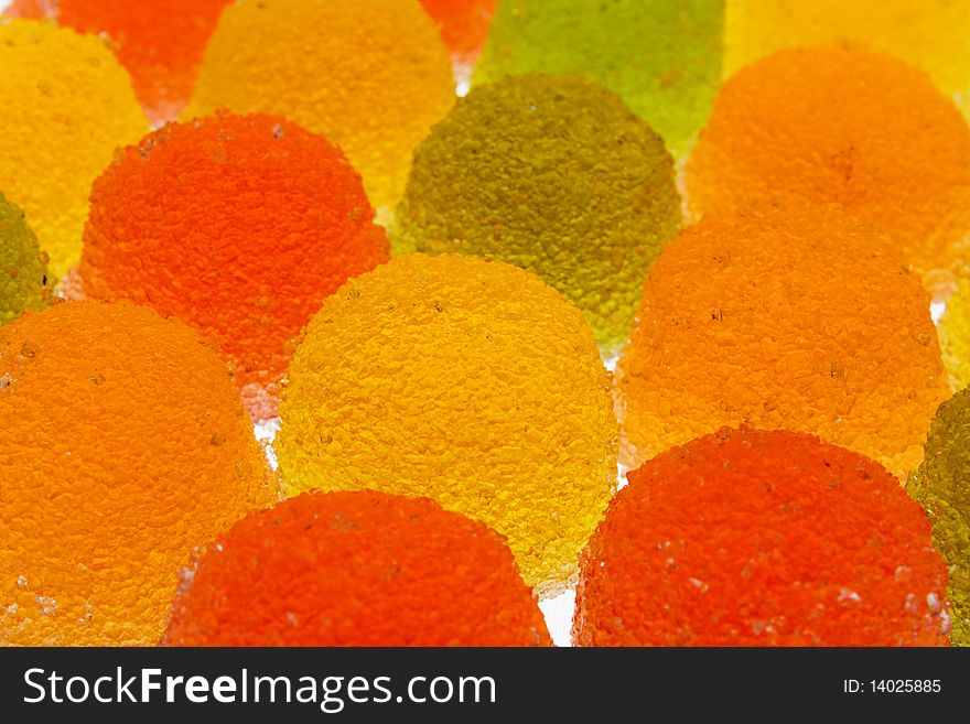 Background of green, yellow, orange and red fruit candyes. Background of green, yellow, orange and red fruit candyes