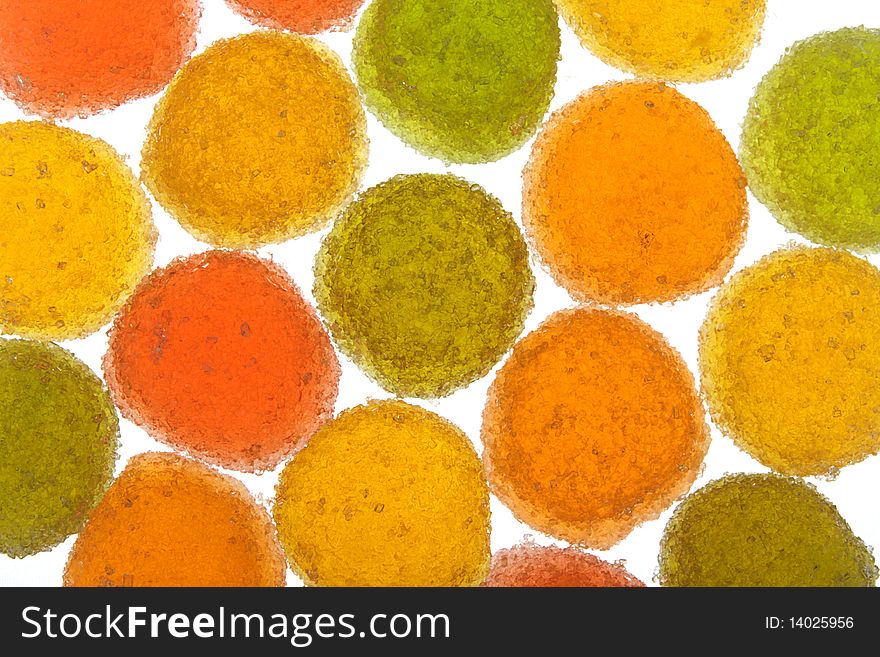 Background of green, yellow, orange and red fruit candyes. Background of green, yellow, orange and red fruit candyes