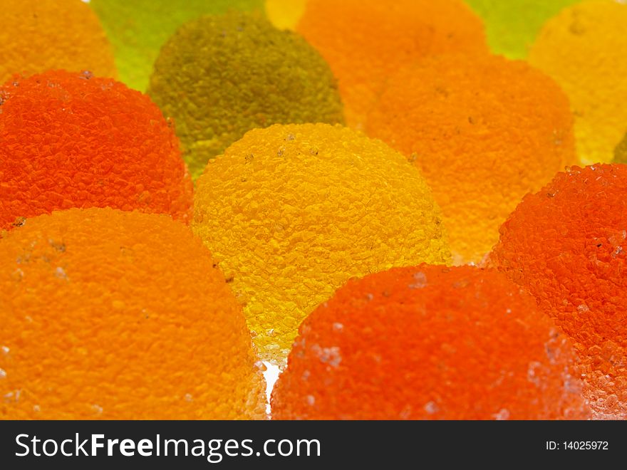 Background of green, yellow, orange and red fruit candyes. Background of green, yellow, orange and red fruit candyes