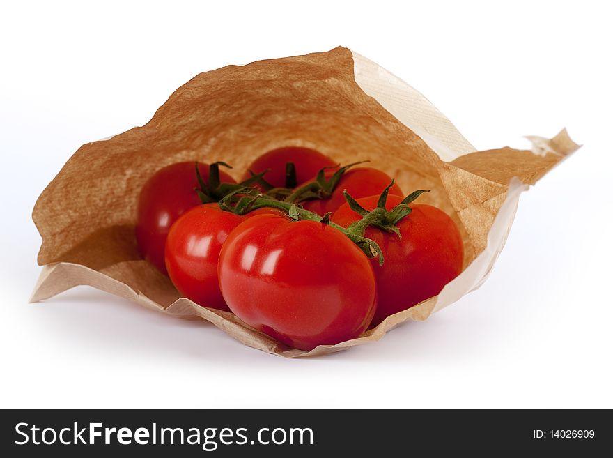 Tomatoes in paper bag, fresh vegetable at the market