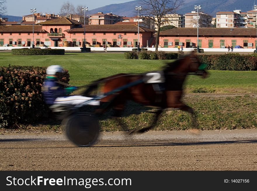 An image of horse trotting cart race competition. An image of horse trotting cart race competition