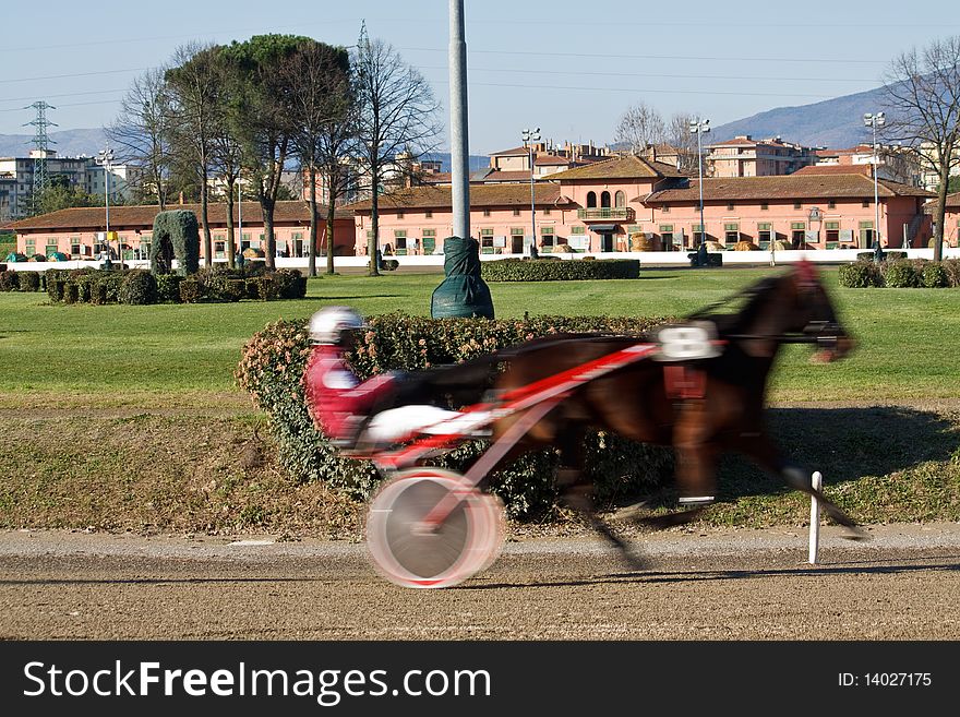 An image of horse trotting cart race competition. An image of horse trotting cart race competition