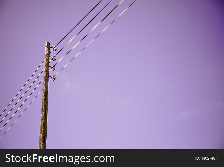 A power line on a purple background. A power line on a purple background