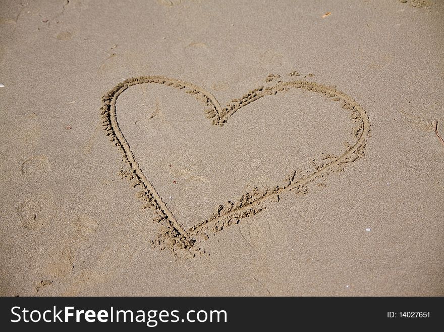 Heart written on the beach to show the love. Heart written on the beach to show the love