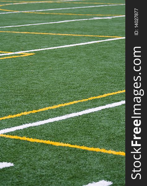 Artificial surface with yellow and white lines for soccer game. Artificial surface with yellow and white lines for soccer game
