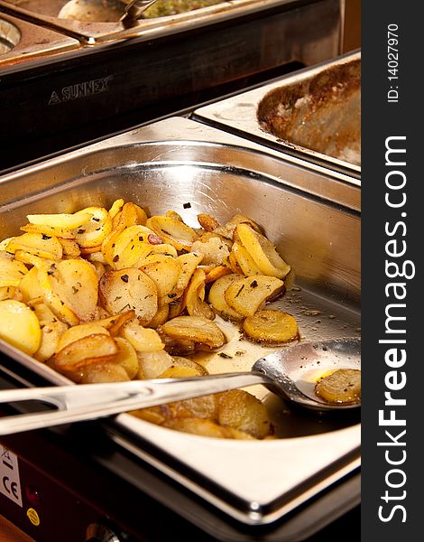 Hot sliced potato from a catering business