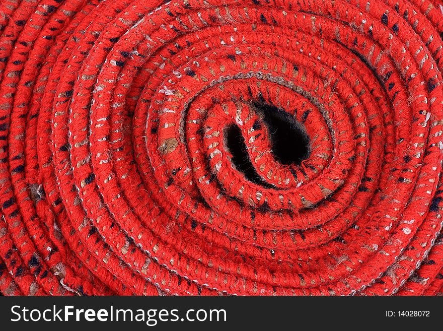 Close up of a red mat  spiral background. Close up of a red mat  spiral background.