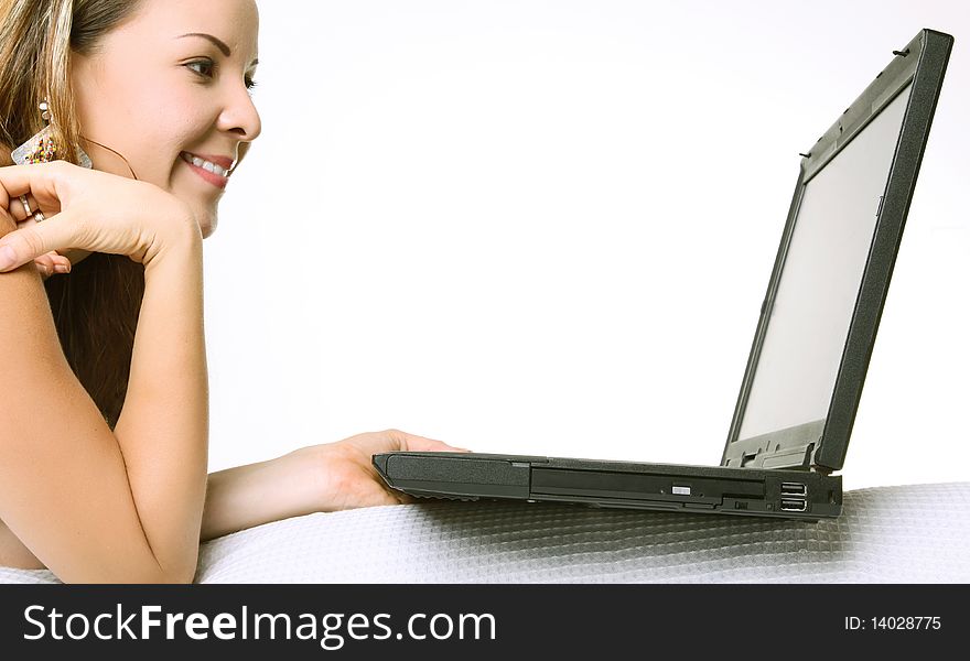 Woman using her laptop over white background