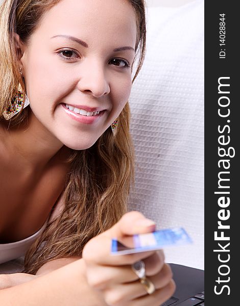 Woman looking at camera and delivery a credit card. Woman looking at camera and delivery a credit card