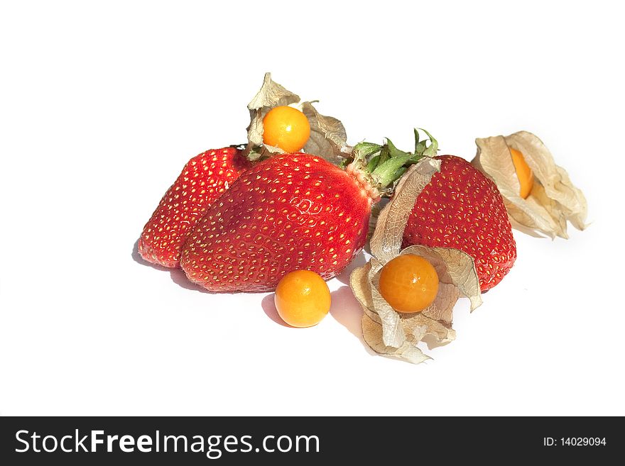 Strawberries and physalis isolated on white background
