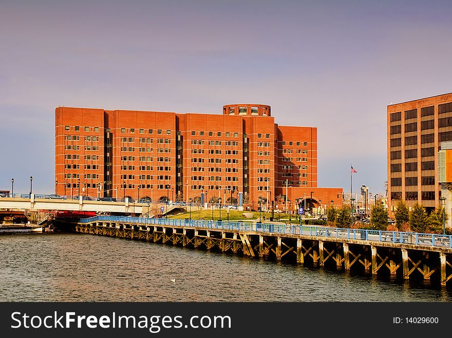 A side view of the Moakley Courthouse from Congress St. across Fort Point Channel near the Children's Museum. A side view of the Moakley Courthouse from Congress St. across Fort Point Channel near the Children's Museum