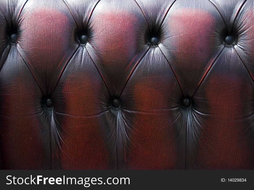 Dark-red texture of furnishing leather. Dark-red texture of furnishing leather