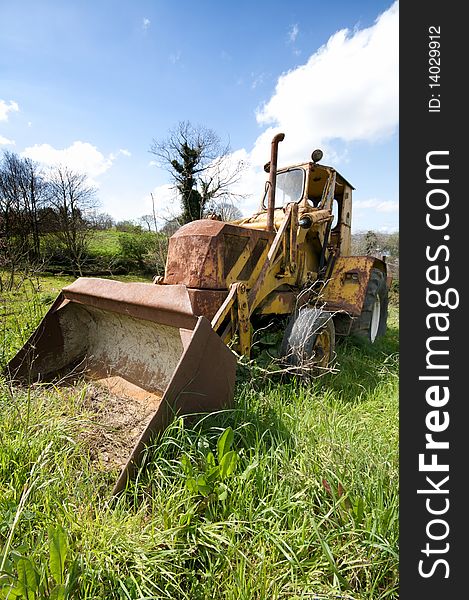 An old abandoned bulldozer in the countryside. An old abandoned bulldozer in the countryside