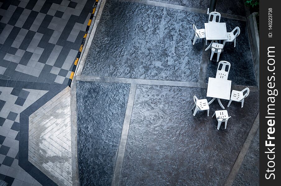 Plastic Tables And Chairs Set On The Footpath And Street Floor