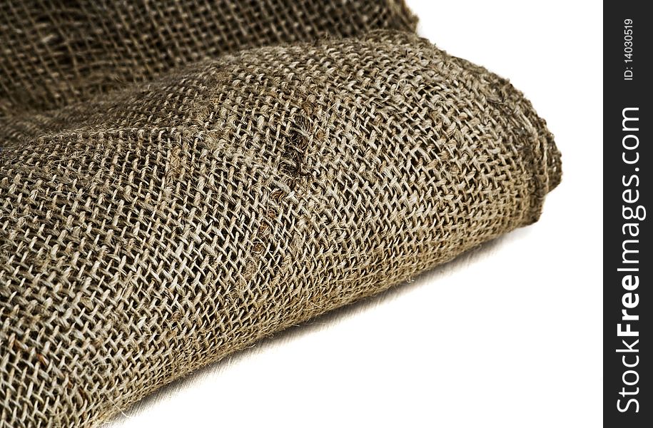 Roll of burlap on a white background
