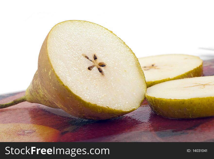 pear on a glass cutting board