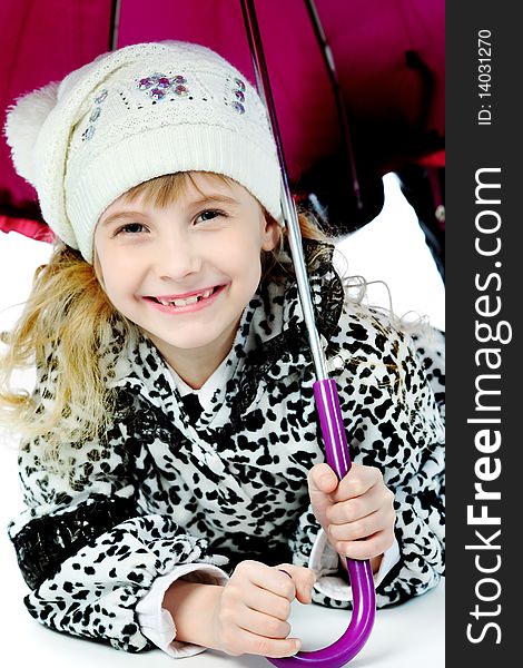 Portrait of a cute girl in a coat holding her umbrella. Portrait of a cute girl in a coat holding her umbrella.