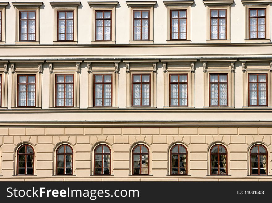 A building with several beautiful window panes in Prague, Czech Republic