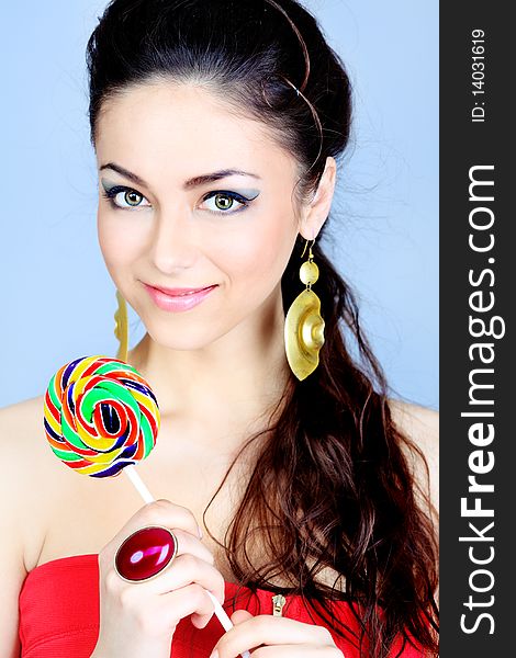 Portrait of a beautiful girl with big lollipop. Portrait of a beautiful girl with big lollipop.