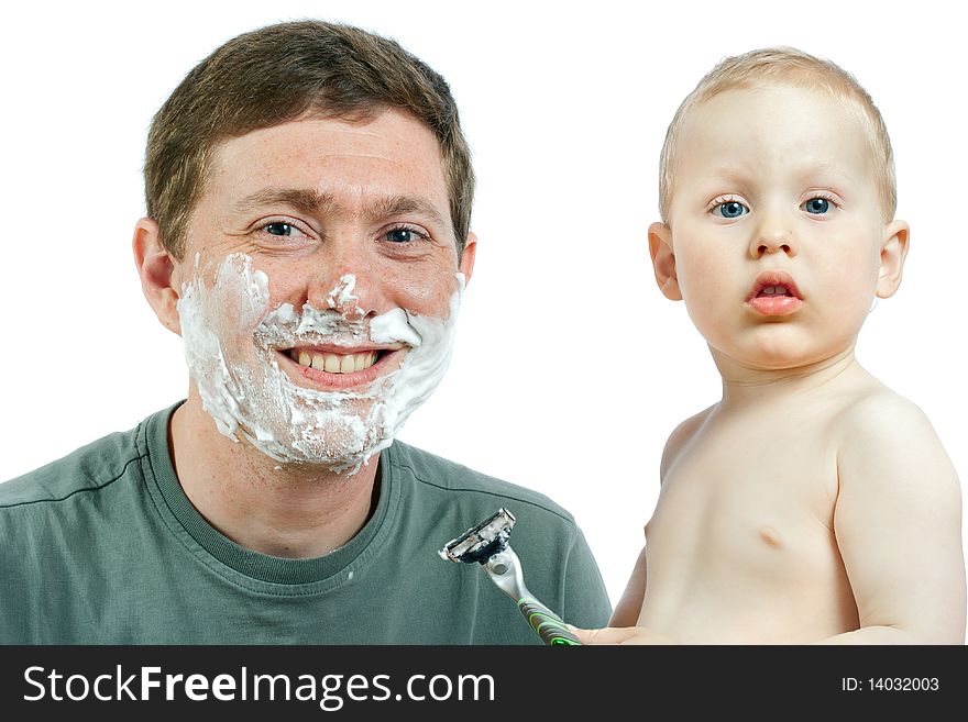 Cute little boy shaving his father - on white background. Cute little boy shaving his father - on white background