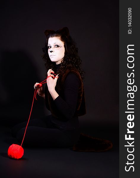 Portrait of a cat-girl with threads ball. Portrait of a cat-girl with threads ball