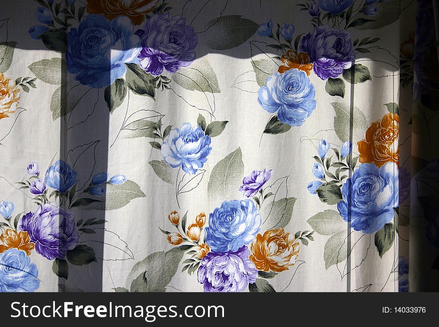 A color flower window curtain as background or texture. A color flower window curtain as background or texture.