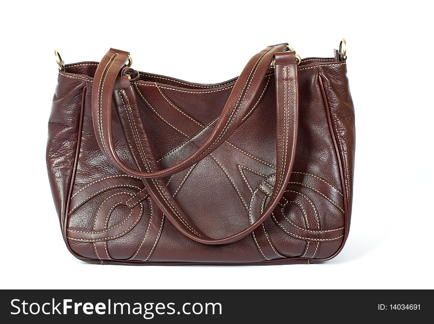 Brown leather woman handbag on the white