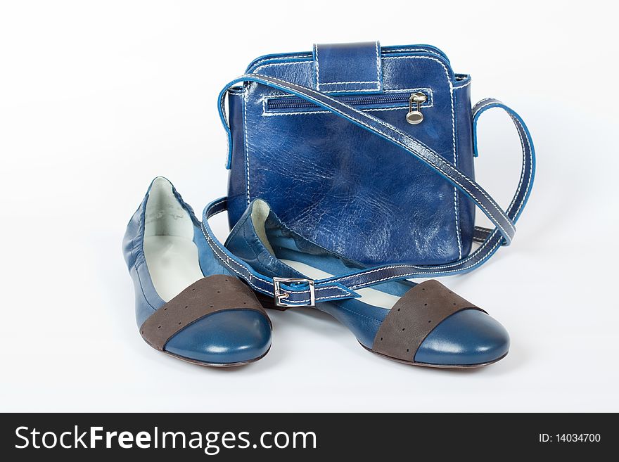 Blue flats and bag on the white background. Blue flats and bag on the white background