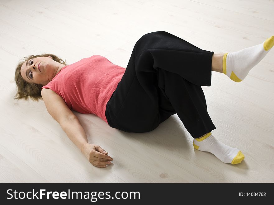 Senior Woman Relaxing On Floor