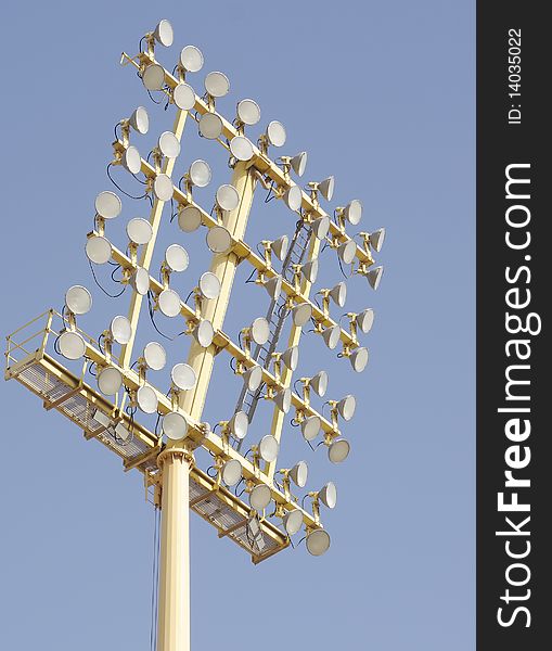 Array of bulbs and refelectors in a floodlight outside a stadium. Array of bulbs and refelectors in a floodlight outside a stadium