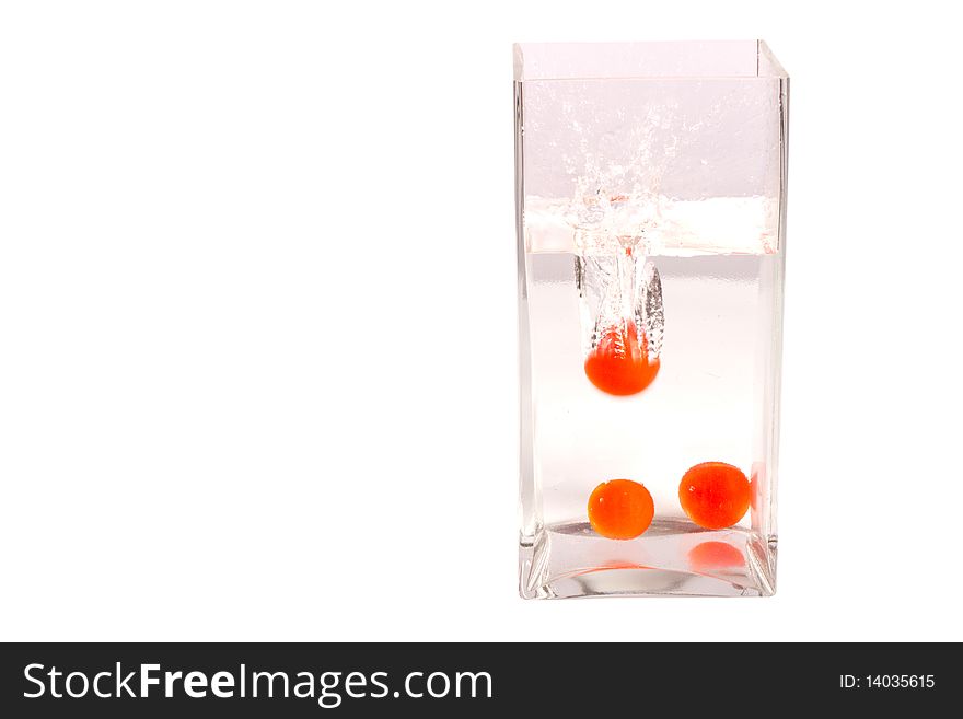 Baby tomatos in water isolated in white