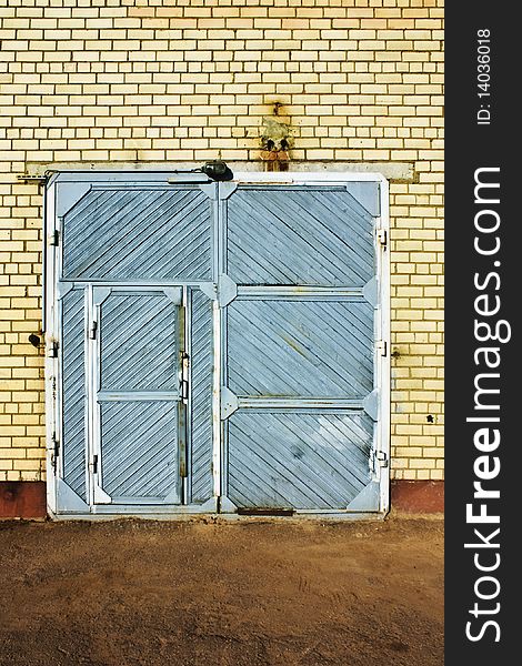 Blue vintage door and the brick wall