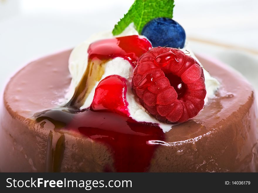 Close up of chocolate jelly with fresh fruits and fruit cream. Close up of chocolate jelly with fresh fruits and fruit cream