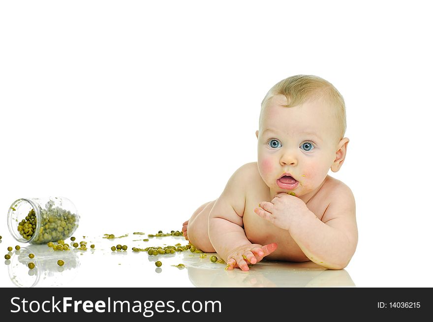 Playing six month baby with jar of pea  on white. Playing six month baby with jar of pea  on white