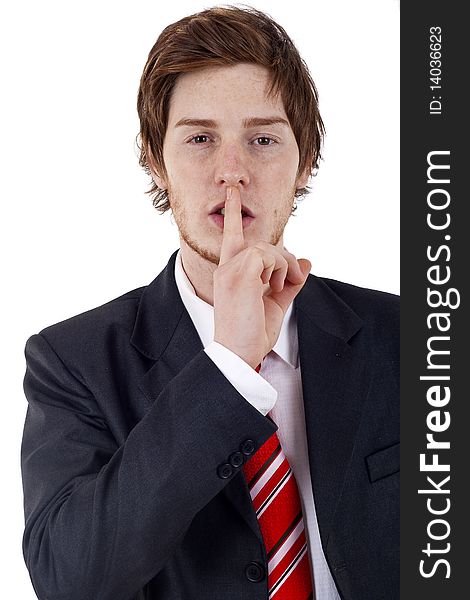 Portrait of businessman showing silence gesture with his forefinger by mouth. Portrait of businessman showing silence gesture with his forefinger by mouth
