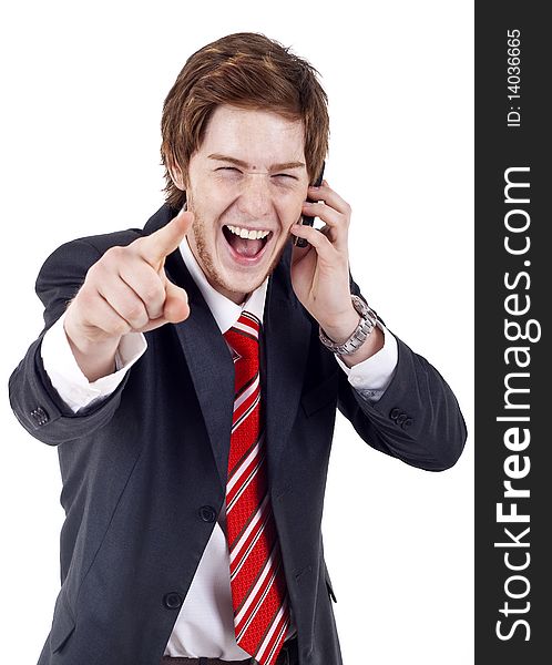 A handsome businessman pointing with finger while talking on the phone. All on white background.