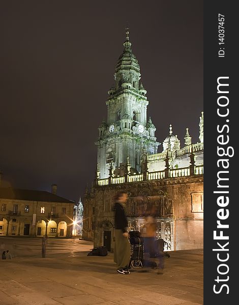 Tourist near Santiago cathedral. Quintana Square. Photo shot at night. Tourist near Santiago cathedral. Quintana Square. Photo shot at night