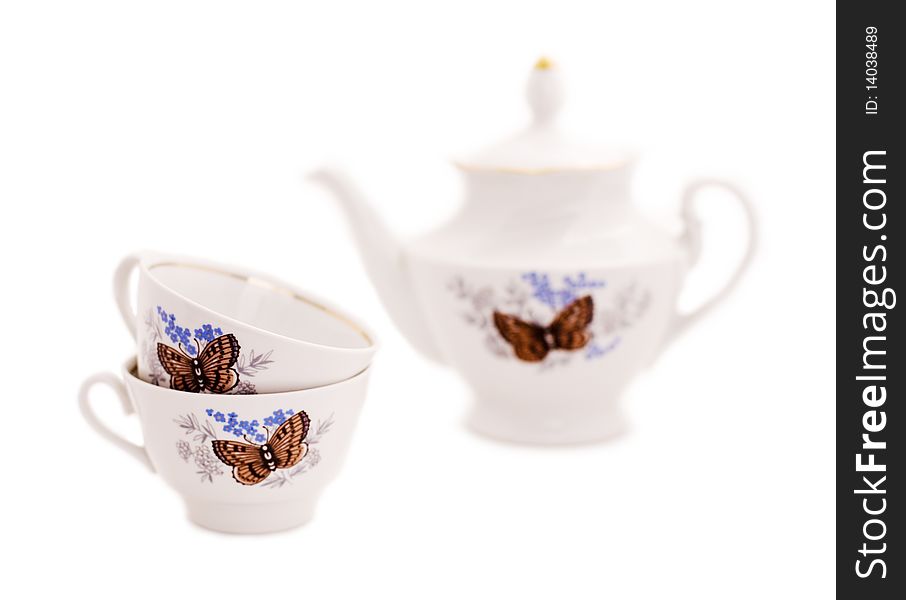 Cups and teapot on a white background