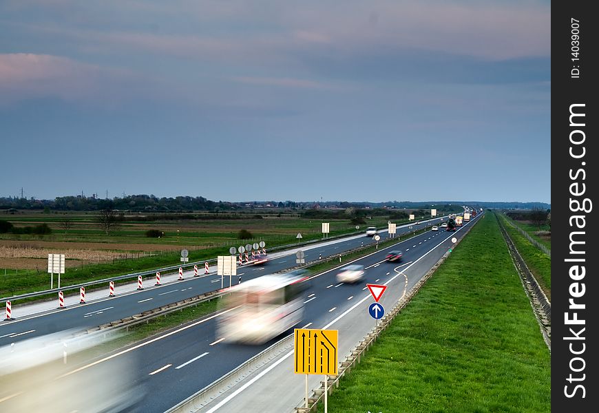 Traffic on a highway in dusk