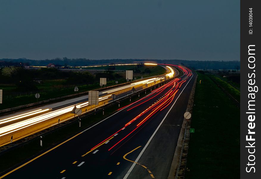 Traffic on a highway making curved light shape. Traffic on a highway making curved light shape