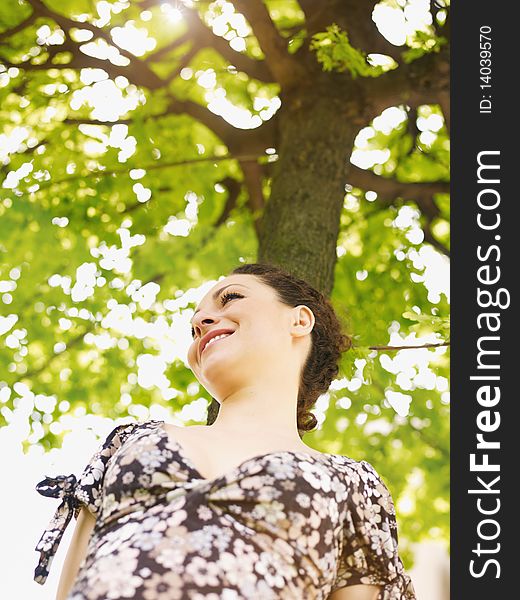 Young woman in park, smiling